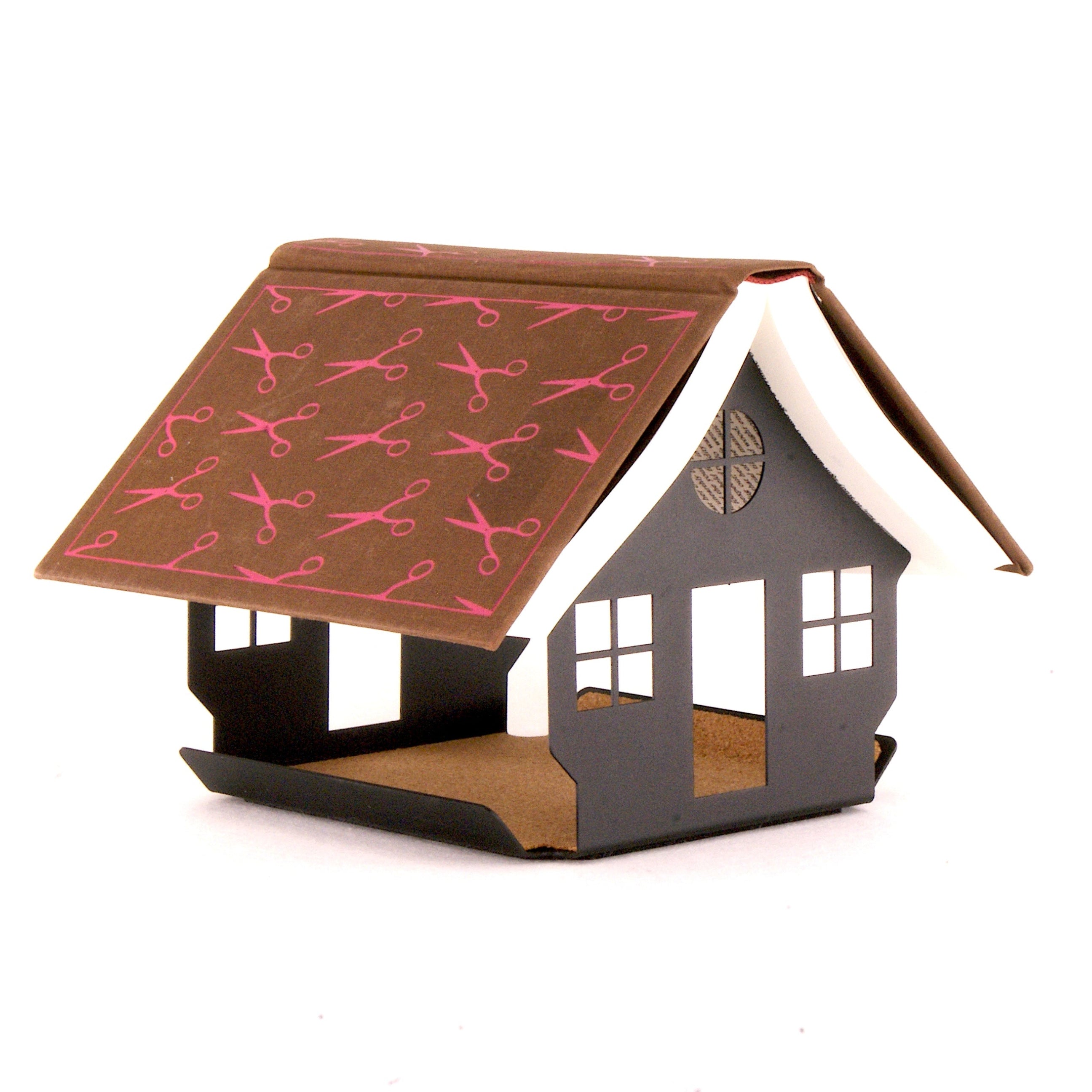 Brown book on a house shaped book rest on a white background