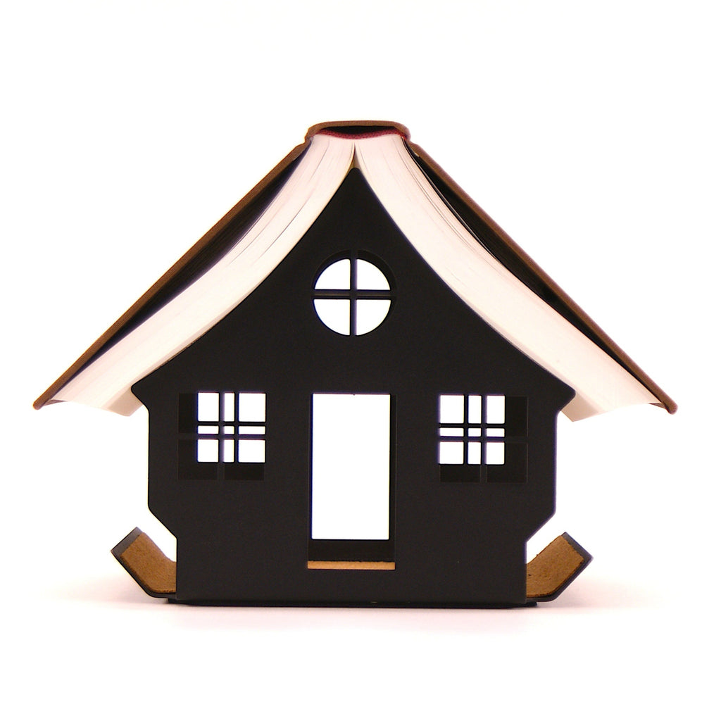 Book on a ouse shaped book rest seen from the front. Shows the curvature of the pages. All on a white background.