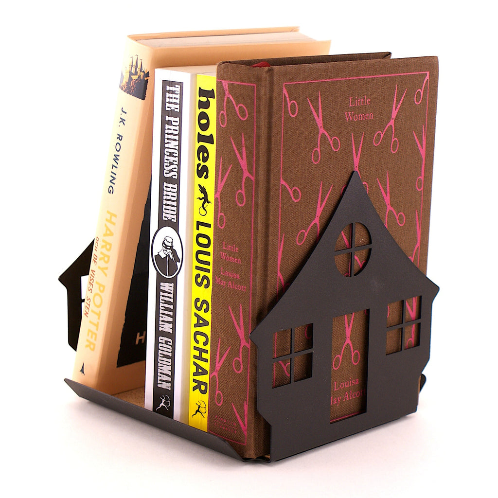 House-shaped bookend holding books on a white background